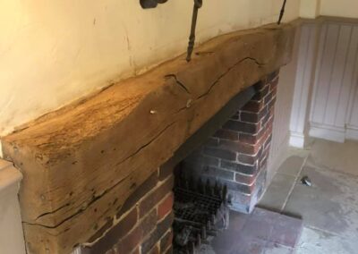 pub fireplace beam restoration after